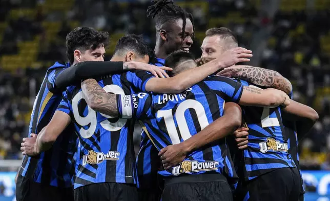 Inter Milan players celebrate after scoring the opening goal during the Italian Super Cup semifinal soccer match between Inter Milan and Atlanta at Al Awwal Park stadium in Riyadh, Saudi Arabia, Thursday, Jan. 2, 2025. (AP Photo/Altaf Qadri)