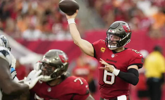 Tampa Bay Buccaneers quarterback Baker Mayfield passes against the Carolina Panthers during the first half of an NFL football game Sunday, Dec. 29, 2024, in Tampa, Fla. (AP Photo/Chris O'Meara)