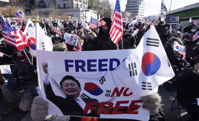 Supporters of impeached South Korean President Yoon Suk Yeol stage a rally to oppose his impeachment near the presidential residence in Seoul, South Korea, Thursday, Jan. 9, 2025. (AP Photo/Ahn Young-joon)