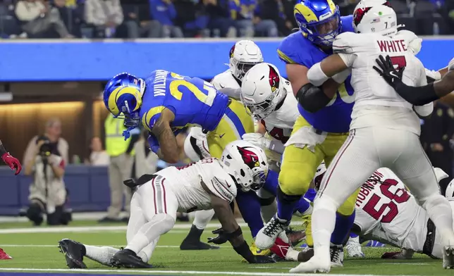 Los Angeles Rams running back Kyren Williams (23) scores a rushing touchdown against the Arizona Cardinals during the first half of an NFL football game Saturday, Dec. 28, 2024, in Inglewood, Calif. (AP Photo/Ryan Sun)