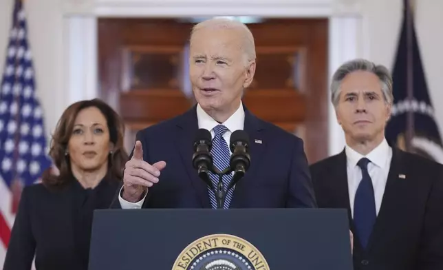 President Joe Biden, center, with Vice President Kamala Harris, left, and Sec. of State Anthony Blinken, right, speaks in the Cross Hall of the White House on the announcement of a ceasefire deal in Gaza and the release of dozens of hostages after more than 15 months of war, Wednesday, Jan. 15, 2025, in Washington. (AP Photo/Evan Vucci)