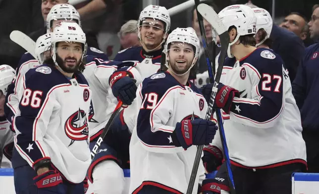Columbus Blue Jackets' Adam Fantilli (19) looks on as fans celebrate his third goal against the Toronto Maple Leafs during third period NHL hockey action in Toronto on Wednesday, January 22, 2025. (Frank Gunn/The Canadian Press via AP)