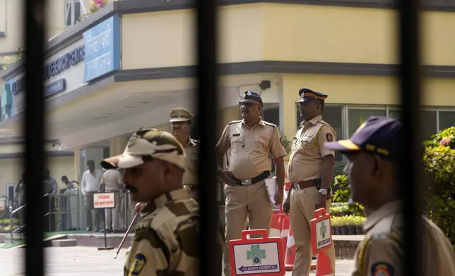 Police personnel stand outside Lilavati hospital where Bollywood actor Saif Ali Khan underwent surgery for stab injuries after a scuffle with an intruder at his home in Mumbai, Thursday, Jan. 16, 2025.(AP Photo/Rajanish Kakade)
