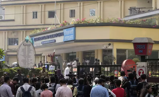 Police and media personnel outside Lilavati hospital where Bollywood actor Saif Ali Khan underwent surgery for stab injuries after a scuffle with an intruder at his home in Mumbai, Thursday, Jan. 16, 2025.(AP Photo/Rajanish Kakade)