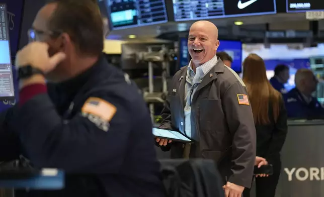 Traders work on the floor at the New York Stock Exchange in New York, Thursday, Jan. 2, 2025. (AP Photo/Seth Wenig)