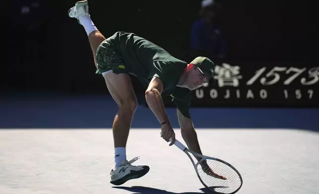 Tommy Paul of the U.S. plays a backhand return to Alexander Zverev of Germany during their quarterfinal match at the Australian Open tennis championship in Melbourne, Australia, Tuesday, Jan. 21, 2025. (AP Photo/Vincent Thian)