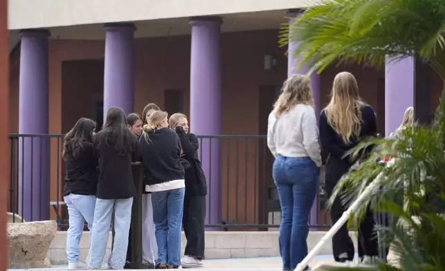 Mourners arrive for a memorial service at First Christian Church in Huntington Beach, Calif., Friday, Jan. 3, 2025, for those killed in a small plane crash the day before. (AP Photo/Damian Dovarganes)