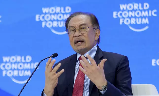 Malaysian Prime Minister Anwar Ibrahim speaks the Annual Meeting of World Economic Forum in Davos, Switzerland, Wednesday, Jan. 22, 2025. (AP Photo/Markus Schreiber)
