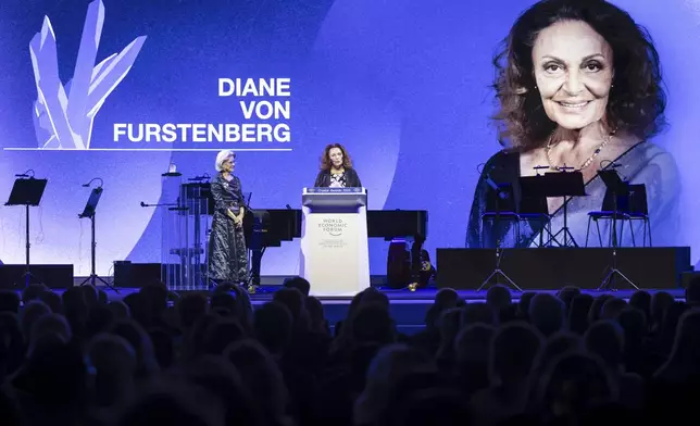 Diane von Furstenberg, Founder and Co-Chairwoman, Diane Von Furstenberg Studio, center, speaks after receiving a Crystal Award from Hilde Schwab, Chairperson and Co-Founder, Schwab Foundation for Social Entrepreneurship, during the ceremony for the Crystal Awards at the 55th annual meeting of the World Economic Forum, WEF, in Davos, Switzerland, on Monday, Jan. 20, 2025. (Michael Buholzer/Keystone via AP)
