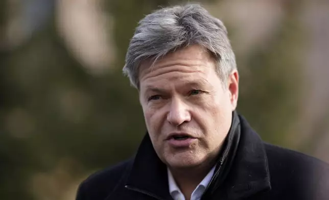 German Economy and Climate Minister Robert Habeck answers questions outside the congress center at the Annual Meeting of World Economic Forum in Davos, Switzerland, Thursday, Jan. 23, 2025. (AP Photo/Markus Schreiber)