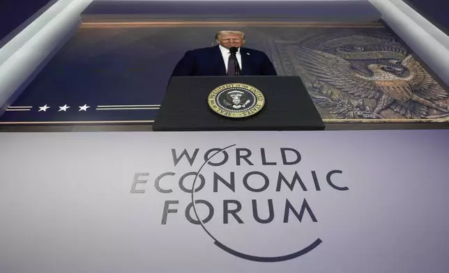 U.S. president Donald Trump is seen on a screen during his virtual speech at the Annual Meeting of World Economic Forum in Davos, Switzerland, Thursday, Jan. 23, 2025. (AP Photo/Markus Schreiber)