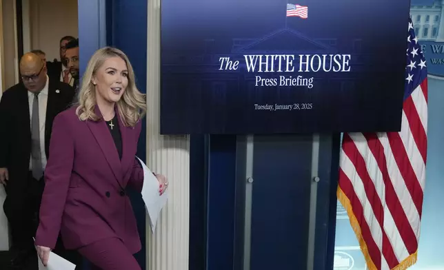 White House press secretary Karoline Leavitt arrives to speak at the daily briefing at the White House in Washington, Tuesday, Jan. 28, 2025. (AP Photo/Ben Curtis)