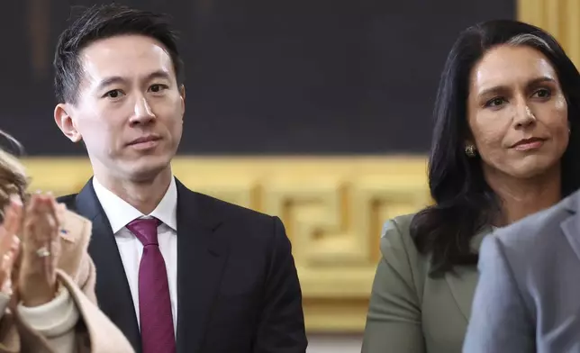 TikTok CEO Shou Zi Chew, center, and Trump's nominee to be Director of National Intelligence Tulsi Gabbard, right, attend the 60th Presidential Inauguration in the Rotunda of the U.S. Capitol in Washington, Monday, Jan. 20, 2025. (Kevin Lamarque/Pool Photo via AP)