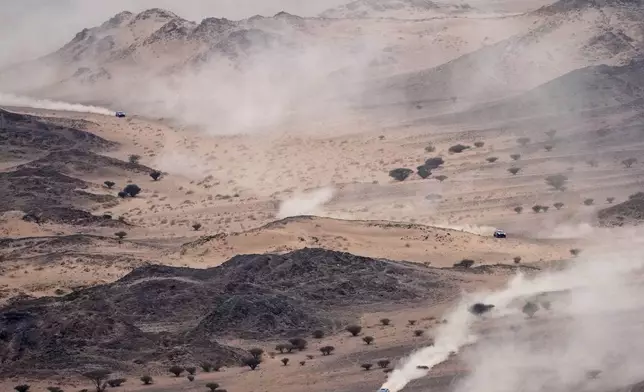 Cars drive during the seventh stage of the Dakar Rally with start and finish in Al Duwadimi, Saudi Arabia, Sunday, Jan. 12, 2025. (AP Photo/Christophe Ena)