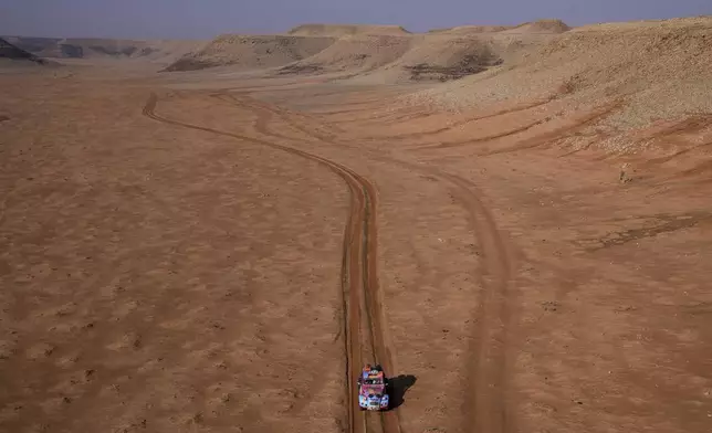 Driver Barbora Holicka and co-driver Lucie Engova drive their Citroen 2CV during the eighth stage of the Dakar Rally Classic between Al Duwadimi and Riyadh, Saudi Arabia, Monday, Jan. 13, 2025. (AP Photo/Christophe Ena)