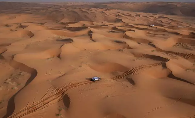 Driver Toby Price and co-driver Sam Sunderland compete during the sixth stage of the Dakar Rally between Hail and Al Duwadimi, Saudi Arabia, Saturday, Jan. 11, 2025. (AP Photo/Christophe Ena)
