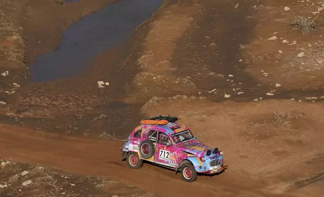 Driver Barbora Holicka and co-driver Lucie Engova drive their Citroen 2CV during the eighth stage of the Dakar Rally Classic between Al Duwadimi and Riyadh, Saudi Arabia, Monday, Jan. 13, 2025. (AP Photo/Christophe Ena)
