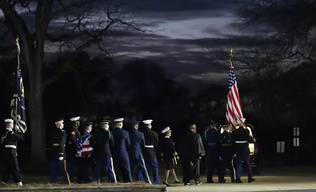 A joint services body bearer team carries the casket after the funeral service for former President Jimmy Carter at Maranatha Baptist Church in Plains, Ga., Thursday, Jan. 9, 2025. Carter died Dec. 29 at the age of 100. (AP Photo/Alex Brandon, Pool)