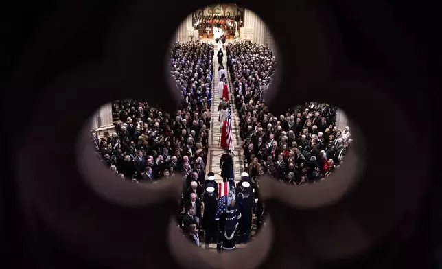 The casket of former President Jimmy Carter arrives for a state funeral at the National Cathedral, Thursday, Jan. 9, 2025, in Washington. (Haiyun Jiang/The New York Times via AP, Pool)