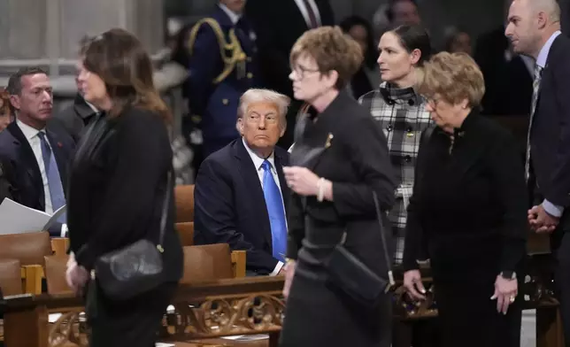 Former President and President-elect Donald Trump arrives to attend the state funeral for former President Jimmy Carter at Washington National Cathedral in Washington, Thursday, Jan. 9, 2025. (AP Photo/Ben Curtis)