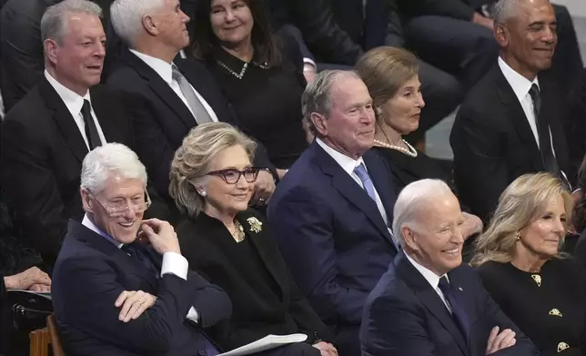 President Joe Biden and first lady Jill Biden, along with former President Bill Clinton, former Secretary of State Hillary Clinton, former President George W. Bush, Laura Bush, and former President Barack Obama listen during the state funeral for former President Jimmy Carter at Washington National Cathedral in Washington, Thursday, Jan. 9, 2025. (AP Photo/Jacquelyn Martin)