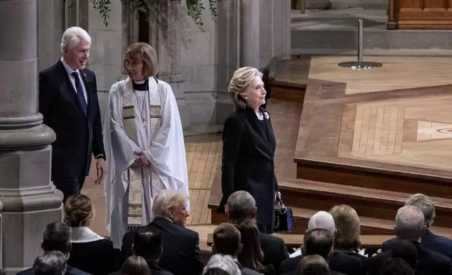 Former President Bill Clinton, left, and former Secretary of State Hillary Clinton, right, arrive at a state funeral for former President Jimmy Carter at the National Cathedral, Thursday, Jan. 9, 2025, in Washington. (Haiyun Jiang/The New York Times via AP, Pool)