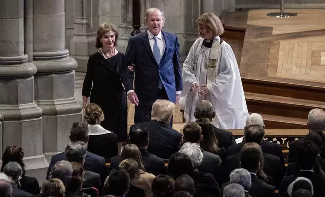 Former first lady Laura Bush, from left, and former President George W. Bush arrive at a state funeral for former President Jimmy Carter at the National Cathedral, Thursday, Jan. 9, 2025, in Washington. (Haiyun Jiang/The New York Times via AP, Pool)