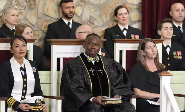 Navy Capt. Judy Malana, Pastor Tony Lowden and Pastor Ashley Guthas listen during the funeral service for former President Jimmy Carter at Maranatha Baptist Church in Plains, Ga., Thursday, Jan. 9, 2025. Carter died Dec. 29 at the age of 100. (AP Photo/Alex Brandon, Pool)