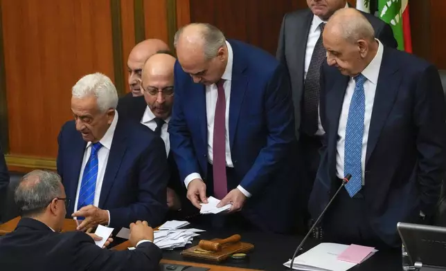 Lebanese lawmakers count the votes after casting their ballots to elect a new president, at the parliament building in downtown Beirut, Lebanon, Thursday, Jan. 9, 2025. (AP Photo/Hussein Malla)