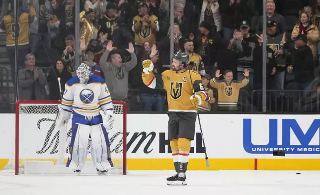 Vegas Golden Knights right wing Mark Stone (61) celebrates after scoring a goal against the Buffalo Sabres during the first period of an NHL hockey game, Saturday, Jan. 4, 2025, in Las Vegas. (AP Photo/Lucas Peltier)