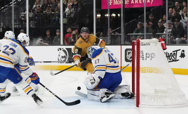 Buffalo Sabres goaltender James Reimer (47) makes a save against Vegas Golden Knights center Jack Eichel (9) during the second period of an NHL hockey game, Saturday, Jan. 4, 2025, in Las Vegas. (AP Photo/Lucas Peltier)