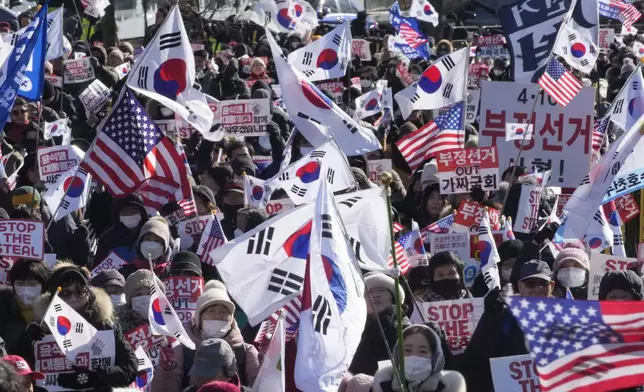 Supporters of impeached South Korean President Yoon Suk Yeol stage a rally to oppose his impeachment near the presidential residence in Seoul, South Korea, Friday, Jan. 10, 2025. (AP Photo/Ahn Young-joon)