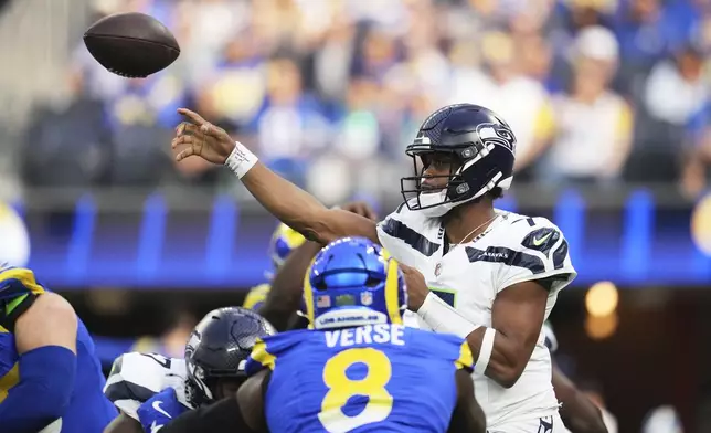 Seattle Seahawks quarterback Geno Smith throws a pass during the first half of an NFL football game against the Los Angeles Rams, Sunday, Jan. 5, 2025, in Inglewood, Calif. (AP Photo/Eric Thayer)