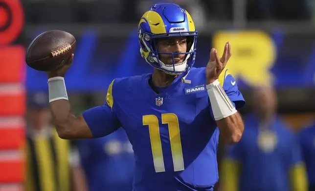 Los Angeles Rams quarterback Jimmy Garoppolo throws a pass during the first half of an NFL football game against the Seattle Seahawks, Sunday, Jan. 5, 2025, in Inglewood, Calif. (AP Photo/Eric Thayer)