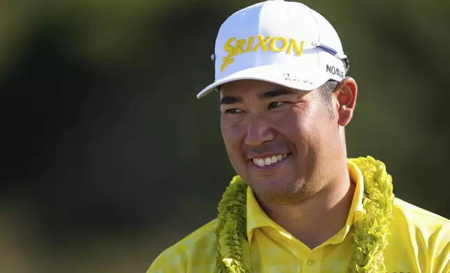 Hideki Matsuyama, of Japan, reacts after winning The Sentry golf event, Sunday, Jan. 5, 2025, at Kapalua Plantation Course in Kapalua, Hawaii. (AP Photo/Matt York)