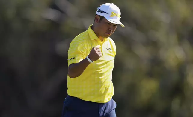 Hideki Matsuyama, of Japan, reacts after sinking a putt on the 18th hole to win The Sentry golf event, Sunday, Jan. 5, 2025, at Kapalua Plantation Course in Kapalua, Hawaii. (AP Photo/Matt York)