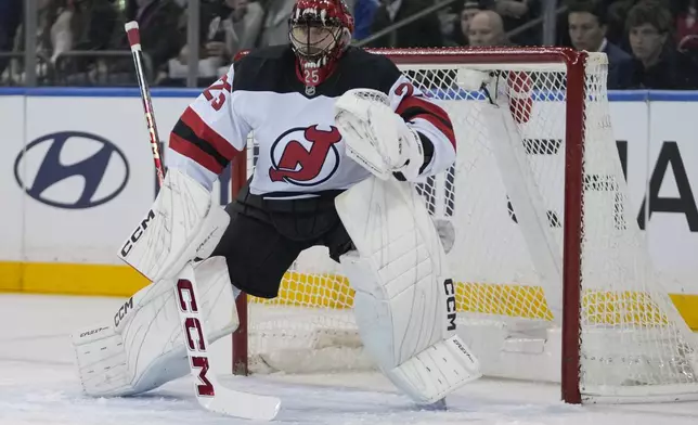 New Jersey Devils goaltender Jacob Markstrom (25) protects the net during the first period of an NHL hockey game against the New York Rangers, Thursday, Jan. 9, 2025, in New York. (AP Photo/Frank Franklin II)