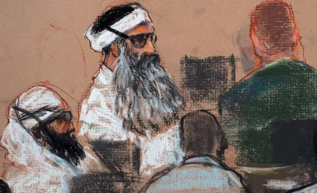 FILE - This Monday, Dec. 8, 2008 courtroom drawing by artist Janet Hamlin and reviewed by the U.S. military, shows Khalid Sheikh Mohammed, center, and co-defendant Walid Bin Attash, left, attending a pre-trial session at Guantanamo Bay Naval Base, Cuba. (AP Photo/Janet Hamlin, Pool, File)