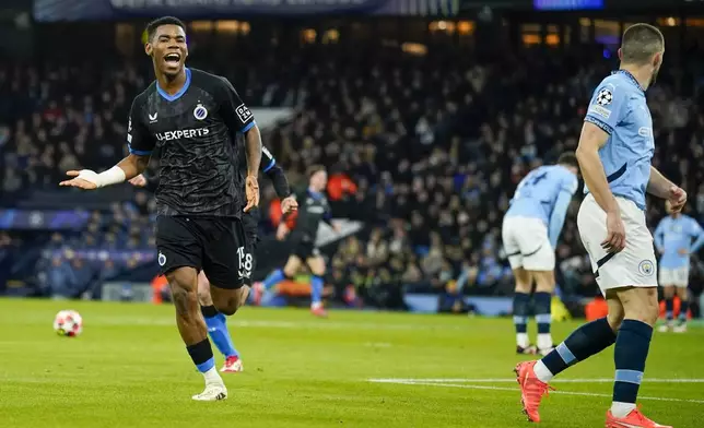 Brugge's Raphael Onyedika celebrates after scoring the opening goal during the Champions League opening phase soccer match between Manchester City and Club Brugge at the Etihad Stadium in Manchester, Wednesday, Jan. 29, 2025. (AP Photo/Dave Thompson)