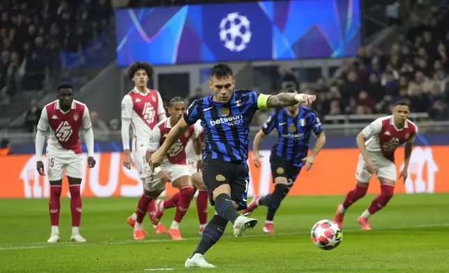 Inter Milan's Lautaro Martinez scores from penalty during a Champions League soccer match between Inter Milan and Monaco, at the San Siro stadium in Milan, Italy, Wednesday, Jan. 29, 2025. (AP Photo/Luca Bruno)