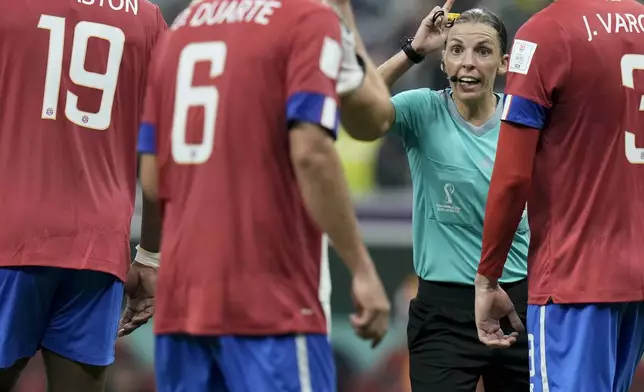FILE - Referee Stephanie Frappart talks to Costa Rica's players during the World Cup group E soccer match between Costa Rica and Germany at the Al Bayt Stadium in Al Khor , Qatar, Dec. 1, 2022. (AP Photo/Hassan Ammar, File)