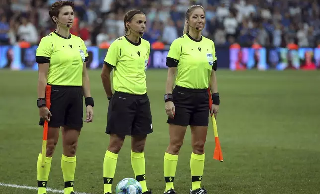 FILE - Assistant referee Michelle O'Neill of Ireland, left, referee Stephanie Frappart of France, center, and assistant referee Manuela Nicolosi of France pose for a picture before the start of the UEFA Super Cup soccer match between Liverpool and Chelsea, in Besiktas Park, in Istanbul, Wednesday, Aug. 14, 2019. (AP Photo, File)