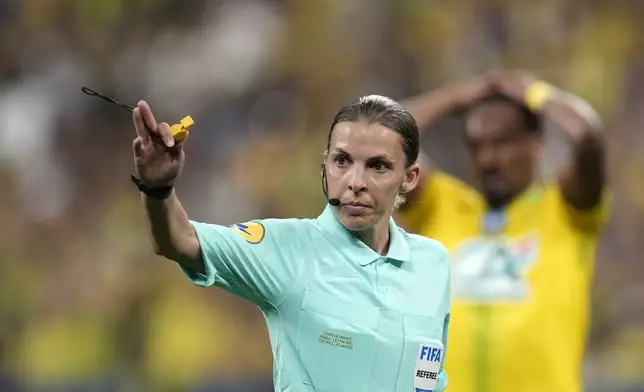 FILE - Referee Stephanie Frappart gives directions during the French Cup final soccer match between Nice and Nantes at the Stade de France stadium, in Saint Denis, north of Paris, Saturday, May 7, 2022. (AP Photo/Christophe Ena, File)