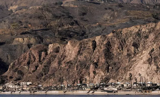 FILE - Damage to beachfront homes by the Palisades Fire is seen along the coastline Wednesday, Jan. 15, 2025 in Malibu, Calif. (AP Photo/Carolyn Kaster, File)