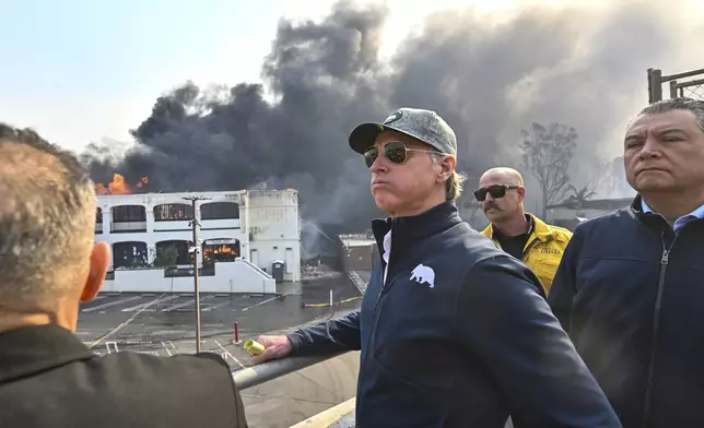FILE - California Governor Gavin Newsom, left, surveys damage in Pacific Palisades with CalFire's Nick Schuler, center, and Senator Alex Padilla, D-Calif.) during the Palisades Fire Wednesday, Jan. 8, 2025, in Pacific Palisades, Calif. (Jeff Gritchen/The Orange County Register via AP, File)