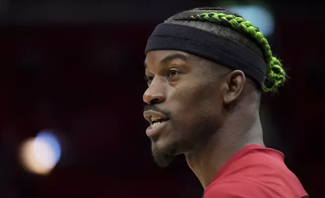 Miami Heat forward Jimmy Butler warms up on the court before an NBA basketball game against the Indiana Pacers Thursday, Jan. 2, 2025, in Miami. (AP Photo/Lynne Sladky)