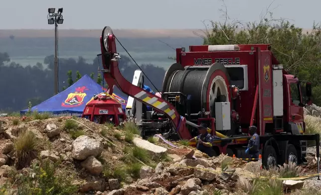 Rescuers work to retrieve miners from ground in an abandoned gold mine for months, in Stilfontein, South Africa, Tuesday, Jan. 14, 2025. (AP Photo/Themba Hadebe)