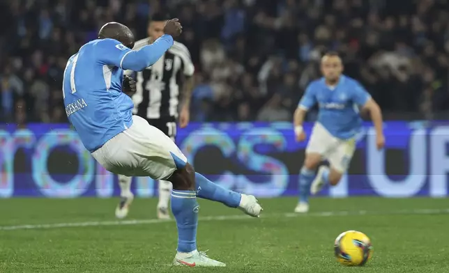 Napoli's Romelu Lukaku scores from the penalty spot for the team's second goal during the Serie A soccer match between Napoli and Juventus at the Diego Armando Maradona Stadium in Naples, Italy, Saturday Jan. 25, 2025. (Alessandro Garofalo/LaPresse via AP)