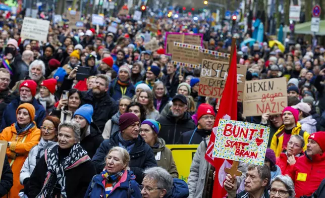 People gather to take part in the "5 before 12 - Loud for Democracy" protest in Cologne, Germany, Saturday Jan. 25, 2025. (Christoph Reichwein/dpa via AP)
