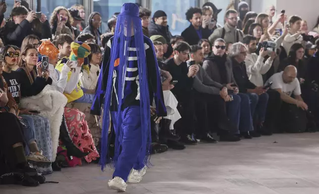 A model wears a creation as part of the men's Walter van Beirendonck Fall-Winter 2025-2026 collection, that was presented in Paris, Wednesday, Jan. 22, 2025. (AP Photo/Thomas Padilla).